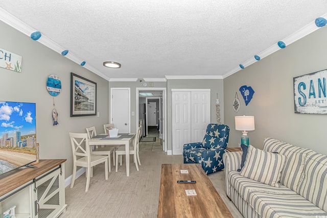 201 S Ocean Blvd Unit 616, Myrtle Beach, SC 29577 - living area featuring a textured ceiling, crown molding, and light wood-style floors
