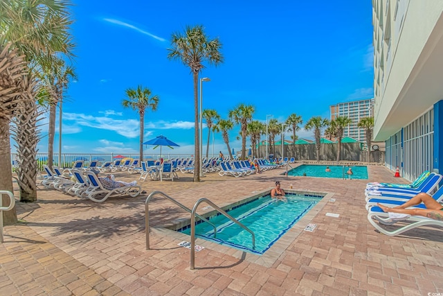 201 S Ocean Blvd Unit 616, Myrtle Beach, SC 29577 - community pool with a patio and a community hot tub