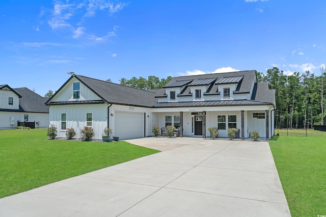 1253 Kenworth Cir, Conway, SC 29526 - modern farmhouse featuring board and batten siding, a standing seam roof, concrete driveway, covered porch, and an attached garage