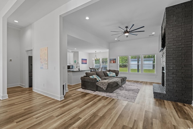 1253 Kenworth Cir, Conway, SC 29526 - living room featuring ceiling fan, light wood-style flooring, recessed lighting, and a brick fireplace