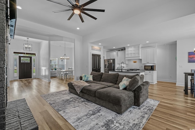1253 Kenworth Cir, Conway, SC 29526 - living area with a chandelier, ceiling fan, light wood finished floors, and recessed lighting