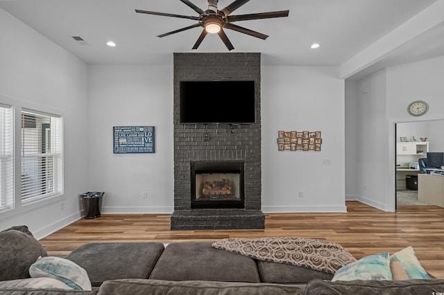 1253 Kenworth Cir, Conway, SC 29526 - living area featuring a ceiling fan, wood finished floors, a fireplace, and recessed lighting