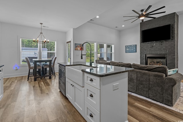 1253 Kenworth Cir, Conway, SC 29526 - kitchen featuring dark countertops, open floor plan, a chandelier, light wood-style floors, and recessed lighting