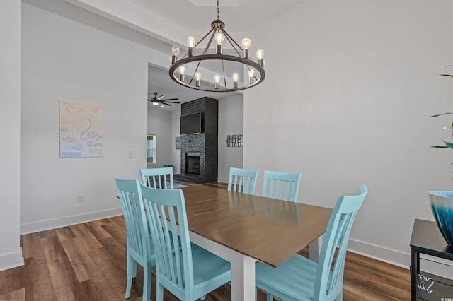1253 Kenworth Cir, Conway, SC 29526 - dining room with a chandelier, a ceiling fan, a fireplace, and wood finished floors