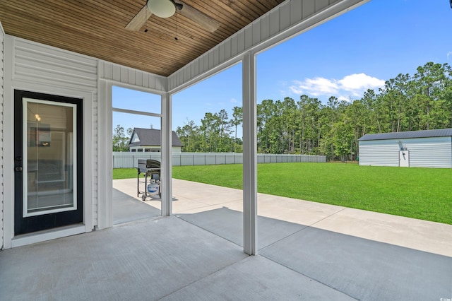 1253 Kenworth Cir, Conway, SC 29526 - fenced backyard with a patio, ceiling fan, and an outdoor structure