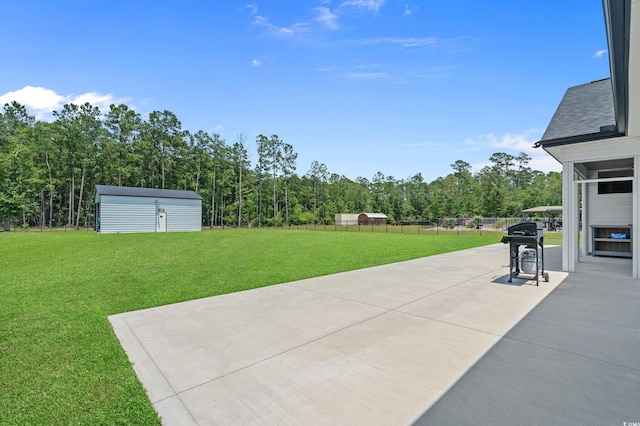 1253 Kenworth Cir, Conway, SC 29526 - view of patio / terrace with area for grilling, a storage unit, and a wooded view