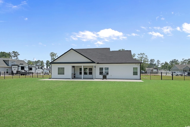 1253 Kenworth Cir, Conway, SC 29526 - back of property featuring a patio area and a fenced backyard