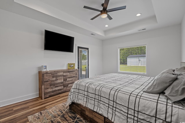 1253 Kenworth Cir, Conway, SC 29526 - bedroom with a tray ceiling, wood finished floors, recessed lighting, ceiling fan, and access to outside