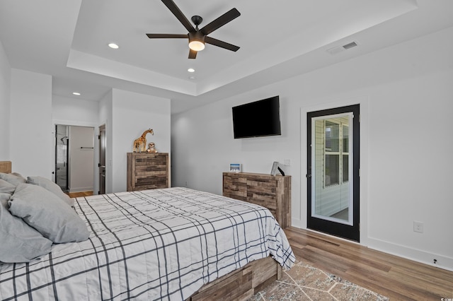 1253 Kenworth Cir, Conway, SC 29526 - bedroom with a tray ceiling, access to exterior, wood finished floors, recessed lighting, and ceiling fan