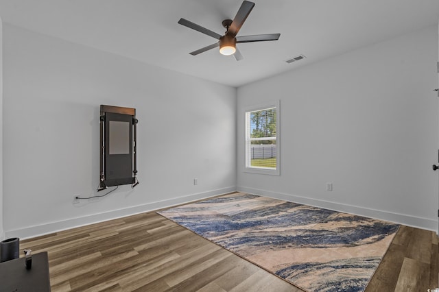 1253 Kenworth Cir, Conway, SC 29526 - empty room with a ceiling fan and wood finished floors