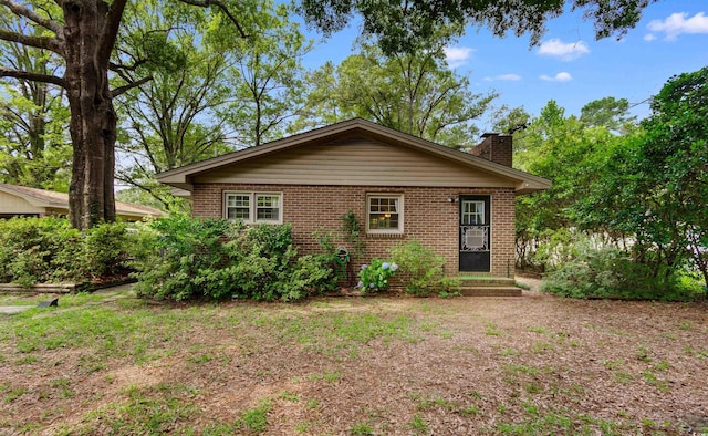 1272 Park Hill Dr, Conway, SC 29526 - view of front of house with brick siding, a chimney, and cooling unit