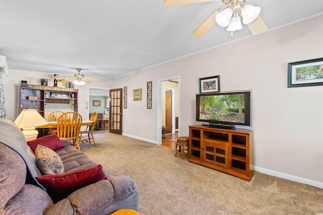 1272 Park Hill Dr, Conway, SC 29526 - carpeted living room featuring a ceiling fan and crown molding
