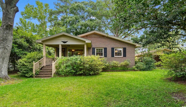 1272 Park Hill Dr, Conway, SC 29526 - bungalow-style house with brick siding, a front yard, and a porch