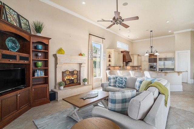 1503 Cadiz Dr, Myrtle Beach, SC 29579 - living area with light tile patterned flooring, crown molding, ceiling fan, recessed lighting, and a high end fireplace