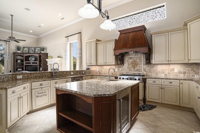 1503 Cadiz Dr, Myrtle Beach, SC 29579 - kitchen with cream cabinets, premium range hood, light tile patterned floors, a peninsula, and ornamental molding