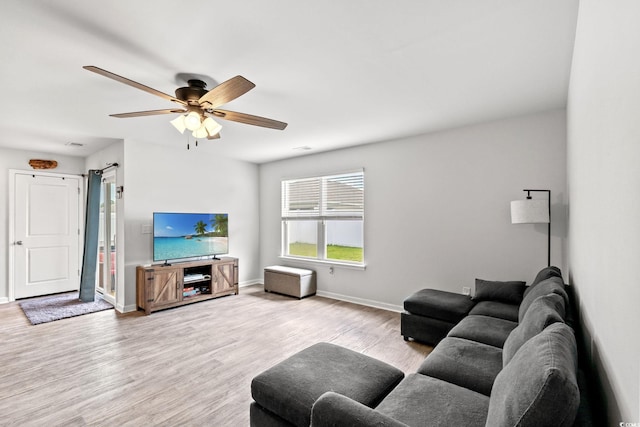 821 Twickenham Loop, Longs, SC 29568 - living room featuring wood finished floors, a ceiling fan, and a barn door