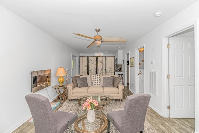 175 Cypress Ln, Little River, SC 29566 - living room featuring light wood-type flooring and ceiling fan