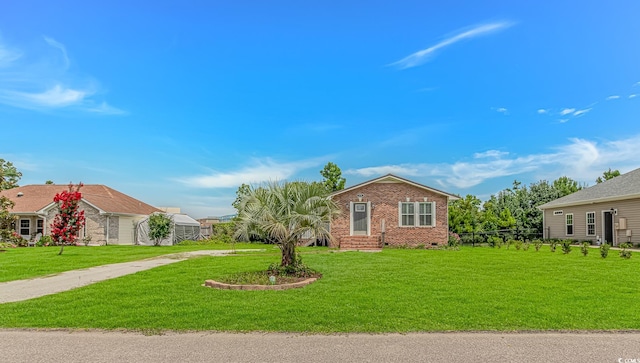 175 Cypress Ln, Little River, SC 29566 - single story home featuring brick siding and a front lawn