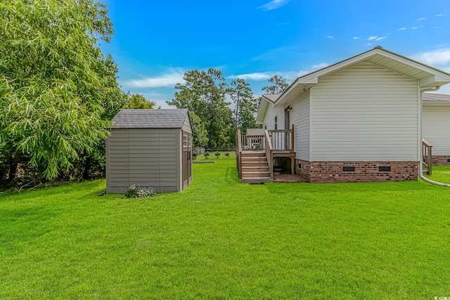 175 Cypress Ln, Little River, SC 29566 - view of grassy yard featuring a storage shed and a deck