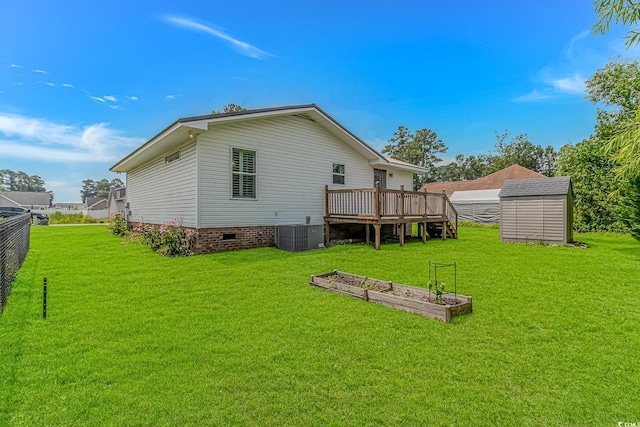175 Cypress Ln, Little River, SC 29566 - back of property featuring a storage unit, a deck, crawl space, and a vegetable garden