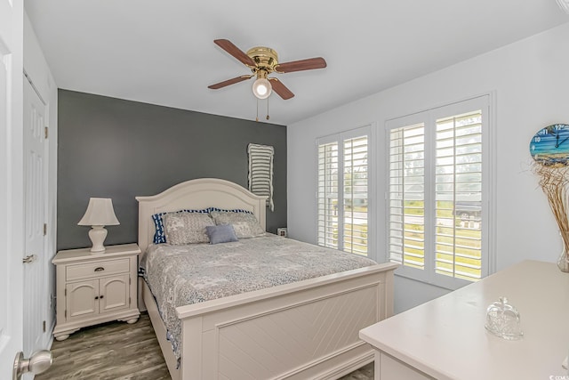 175 Cypress Ln, Little River, SC 29566 - bedroom featuring multiple windows, dark wood-style floors, and a ceiling fan