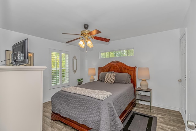 175 Cypress Ln, Little River, SC 29566 - bedroom featuring multiple windows, wood finished floors, and ceiling fan