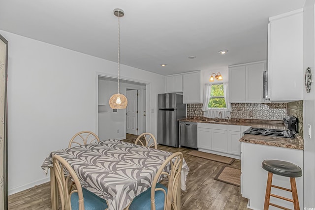 175 Cypress Ln, Little River, SC 29566 - dining space with dark wood-style floors and recessed lighting