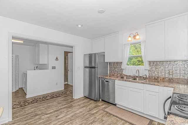 175 Cypress Ln, Little River, SC 29566 - kitchen featuring appliances with stainless steel finishes, white cabinets, and light wood-type flooring