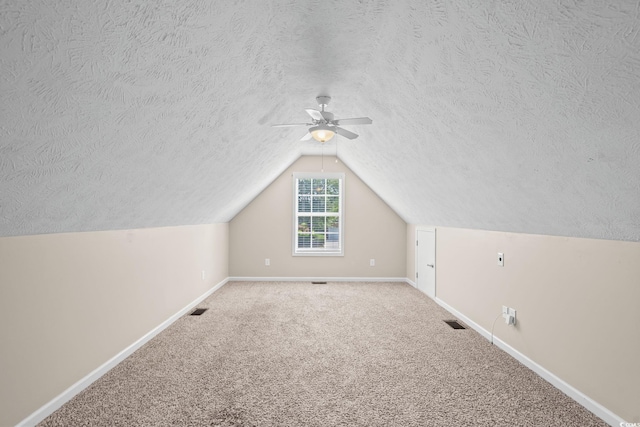 5008 Hayes Bay Ct, Murrells Inlet, SC 29576 - additional living space with a textured ceiling, a ceiling fan, lofted ceiling, and carpet floors