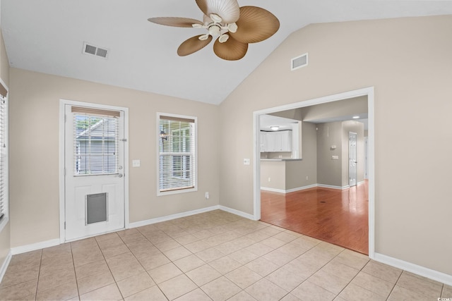 5008 Hayes Bay Ct, Murrells Inlet, SC 29576 - unfurnished living room featuring a ceiling fan, light tile patterned flooring, and high vaulted ceiling