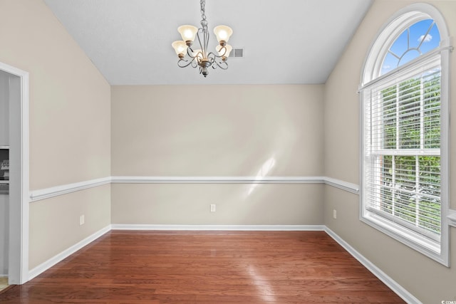 5008 Hayes Bay Ct, Murrells Inlet, SC 29576 - unfurnished room with a chandelier, plenty of natural light, wood finished floors, and lofted ceiling