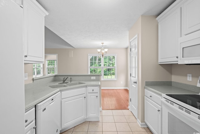 5008 Hayes Bay Ct, Murrells Inlet, SC 29576 - kitchen with white appliances, a chandelier, white cabinetry, and a textured ceiling