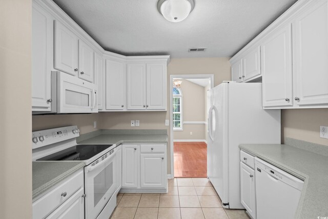 5008 Hayes Bay Ct, Murrells Inlet, SC 29576 - kitchen featuring white appliances, white cabinetry, light tile patterned floors, and light countertops