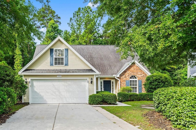 5008 Hayes Bay Ct, Murrells Inlet, SC 29576 - traditional home featuring driveway, a garage, a shingled roof, and brick siding