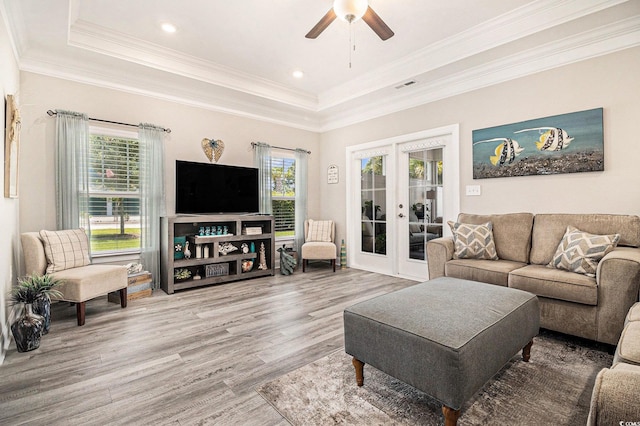 800 Monarch Dr Unit 49, Myrtle Beach, SC 29588 - living area featuring a tray ceiling, wood finished floors, french doors, ceiling fan, and ornamental molding