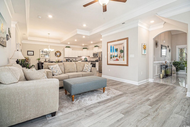 800 Monarch Dr Unit 49, Myrtle Beach, SC 29588 - living area featuring arched walkways, ceiling fan, light wood finished floors, recessed lighting, and a tray ceiling