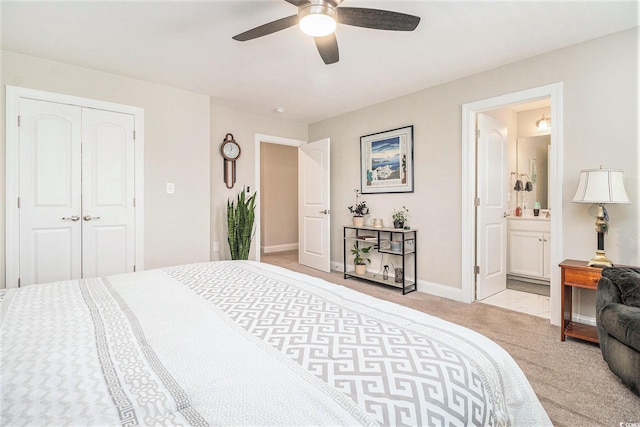 800 Monarch Dr Unit 49, Myrtle Beach, SC 29588 - bedroom with light colored carpet, a closet, a ceiling fan, and connected bathroom
