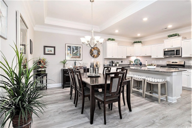 800 Monarch Dr Unit 49, Myrtle Beach, SC 29588 - dining room featuring light wood finished floors, a chandelier, a tray ceiling, ornamental molding, and recessed lighting