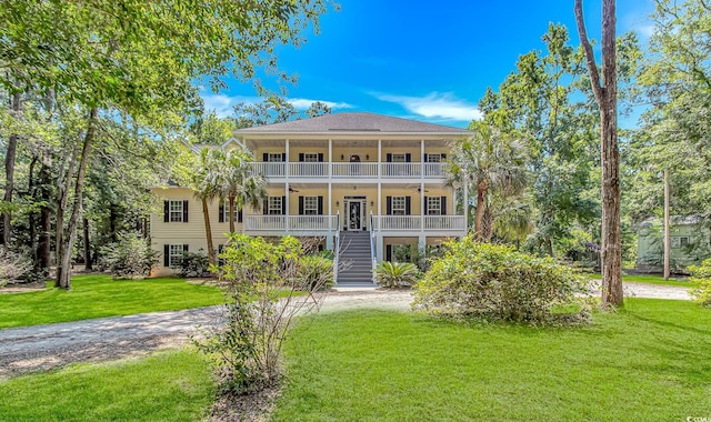 1176 Old Plantation Dr, Pawleys Island, SC 29585 - view of front of property with ceiling fan, stairway, a front yard, covered porch, and a shingled roof