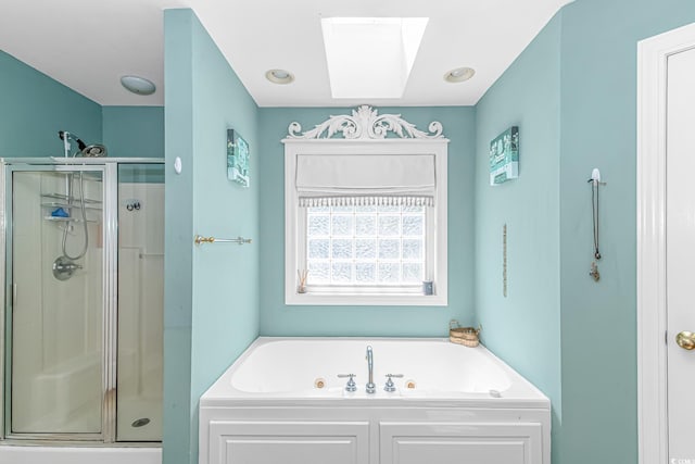 1176 Old Plantation Dr, Pawleys Island, SC 29585 - bathroom featuring a skylight, a whirlpool tub, and a stall shower