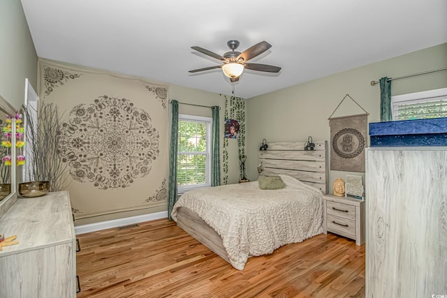 1176 Old Plantation Dr, Pawleys Island, SC 29585 - bedroom featuring light wood-style flooring and ceiling fan