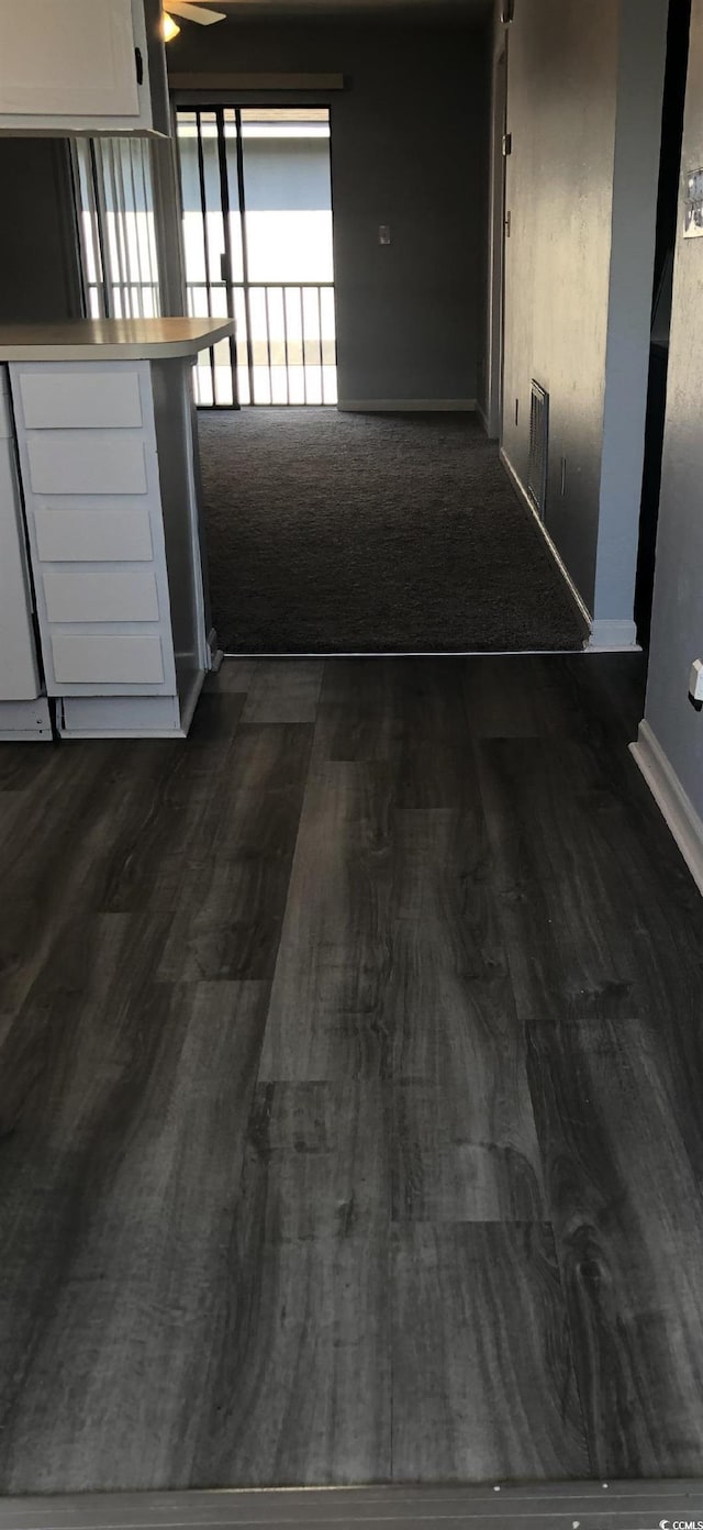 1101 2nd Ave N Unit 306, Surfside Beach, SC 29575 - hall featuring dark wood-type flooring and baseboards