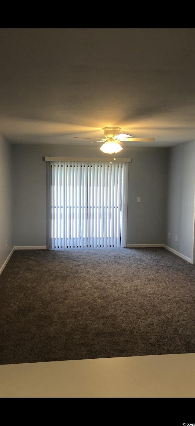 1101 2nd Ave N Unit 306, Surfside Beach, SC 29575 - carpeted empty room with baseboards and a ceiling fan