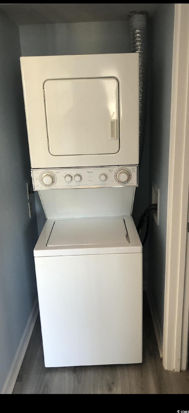 1101 2nd Ave N Unit 306, Surfside Beach, SC 29575 - laundry area with estacked washer and dryer and wood finished floors