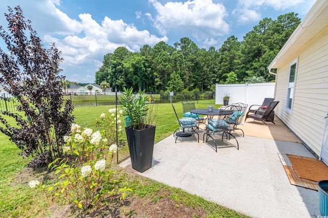 805 Cherry Bark Ct, Myrtle Beach, SC 29579 - fenced backyard with a patio area and outdoor dining area
