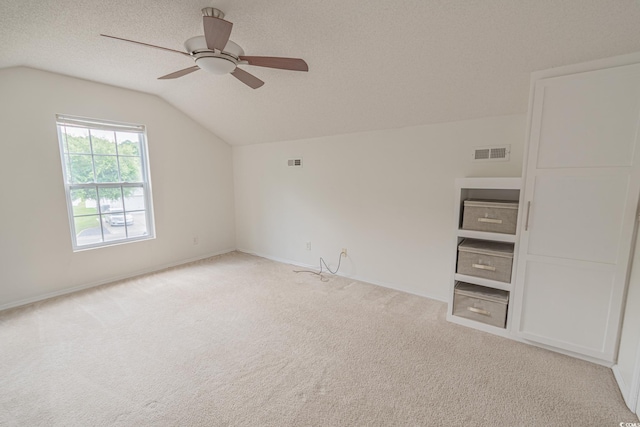 805 Cherry Bark Ct, Myrtle Beach, SC 29579 - unfurnished room featuring lofted ceiling, carpet flooring, a ceiling fan, and a textured ceiling