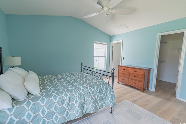 805 Cherry Bark Ct, Myrtle Beach, SC 29579 - bedroom with light wood-style floors, vaulted ceiling, a walk in closet, and ceiling fan