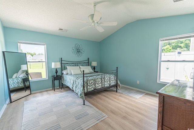 805 Cherry Bark Ct, Myrtle Beach, SC 29579 - bedroom with light wood-type flooring, lofted ceiling, multiple windows, and a ceiling fan