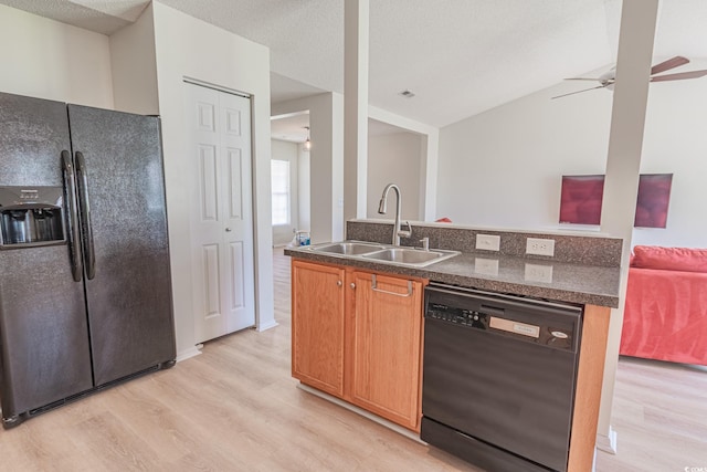 805 Cherry Bark Ct, Myrtle Beach, SC 29579 - kitchen featuring black appliances, light wood-style floors, ceiling fan, dark countertops, and lofted ceiling