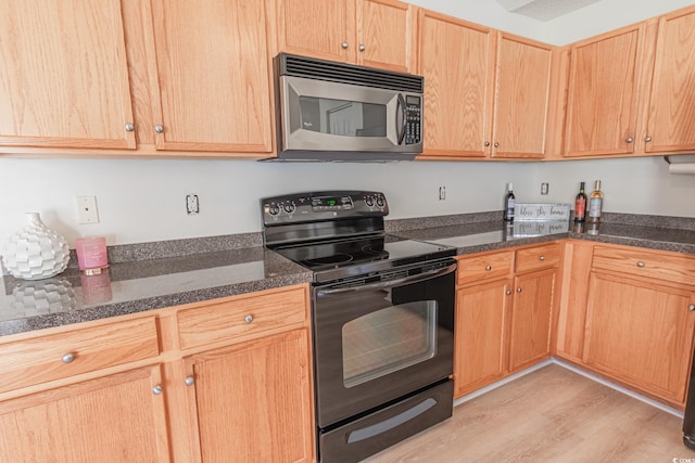 805 Cherry Bark Ct, Myrtle Beach, SC 29579 - kitchen featuring stainless steel microwave, black electric range oven, light wood-style floors, light brown cabinetry, and dark stone countertops